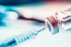 Close-up medical syringe with ozone for spinal cord catheterization procedure.